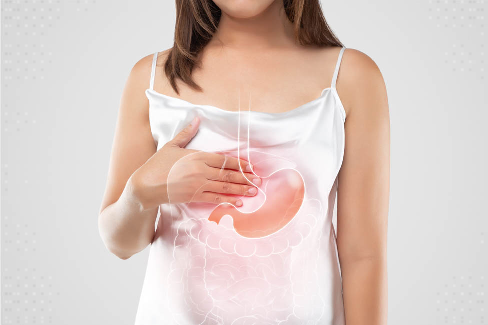 A woman in white dress suffering from acid reflux or GERD on a light gray background, Gastroesophageal Reflux Disease, The concept of Medical treatment and Healthcare