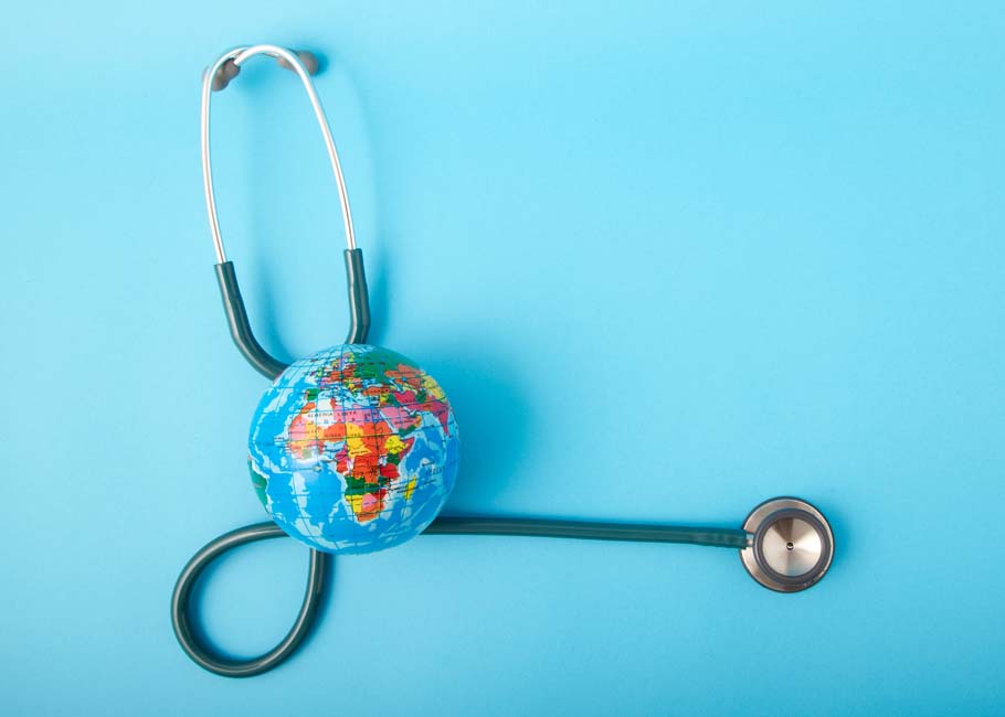 World health day ,Stethoscope wrapped around globe on pastel blue background. Save the wold, Global health care and Green Earth day concept