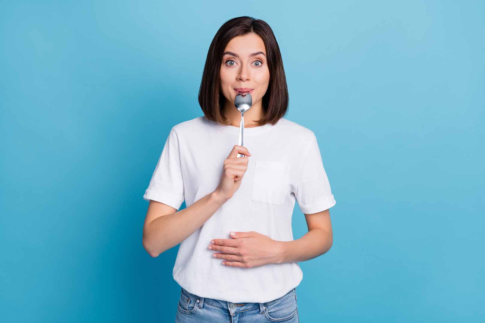 Photo of young pretty funny lady hold metal spoon in mouth