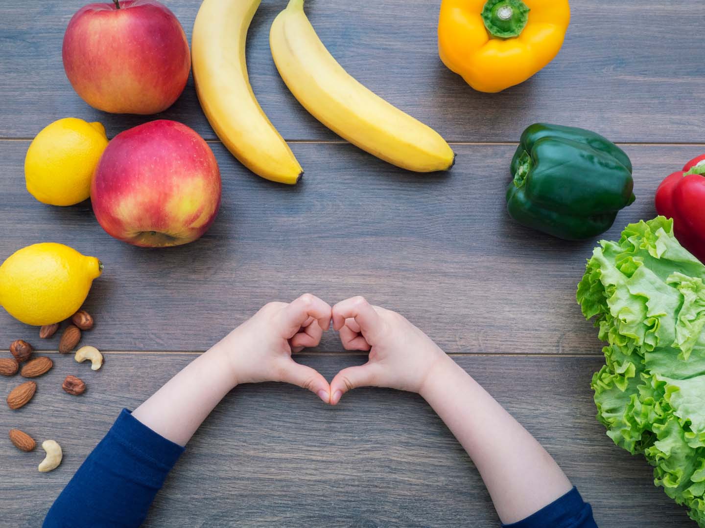 Kid,Making,Heart,Shape,With,Her,Hands,And,Healthy,Food